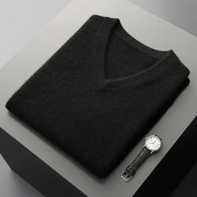 Colete masculino em lã  com gola V dobrado sobre superfície minimalista com visual elegante